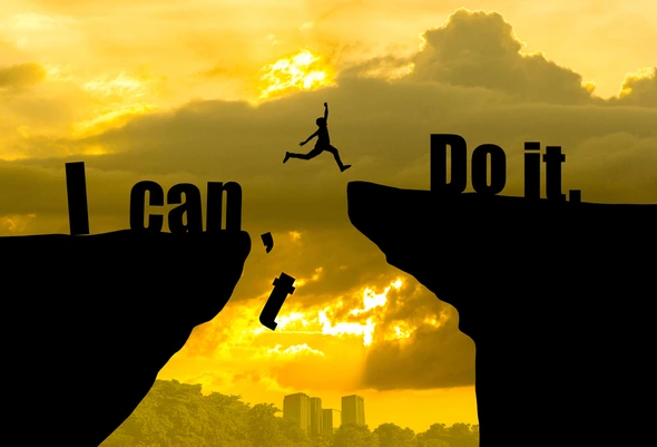 man-jumping-on-can-do-600nw-540356668